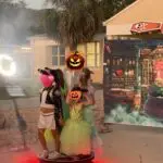 Guests enjoying the Premier DJ Services 360 Photo Booth at a themed event