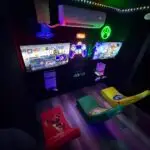 Premier GameVerse Mobile Arcade trailer featuring arcade games, PlayStation, Xbox, and Nintendo gaming stations