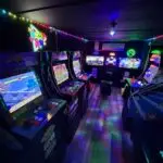Premier GameVerse Mobile Arcade trailer featuring arcade games, PlayStation, Xbox, and Nintendo gaming stations