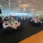 Elegant banquet hall event with guests enjoying entertainment and celebration
