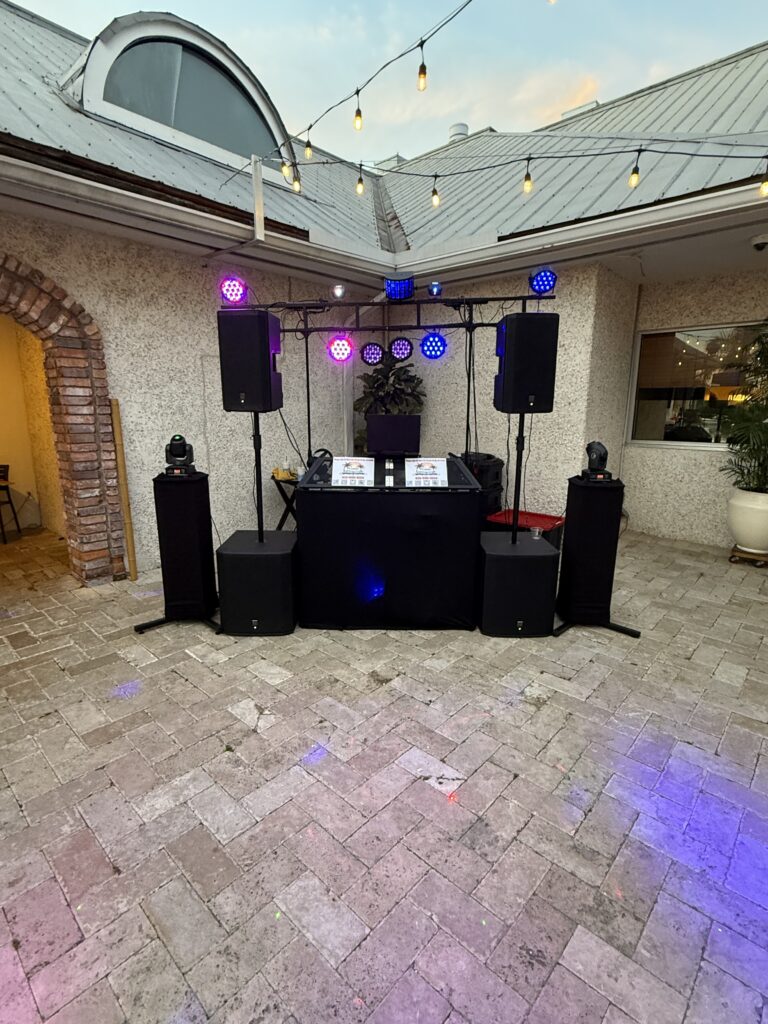 DJ Services Professional DJ setup with speakers and lighting by Premier DJ Services