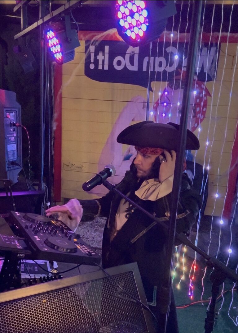 DJ Services DJ Mike performing in a Halloween costume at an event with Premier DJ Services